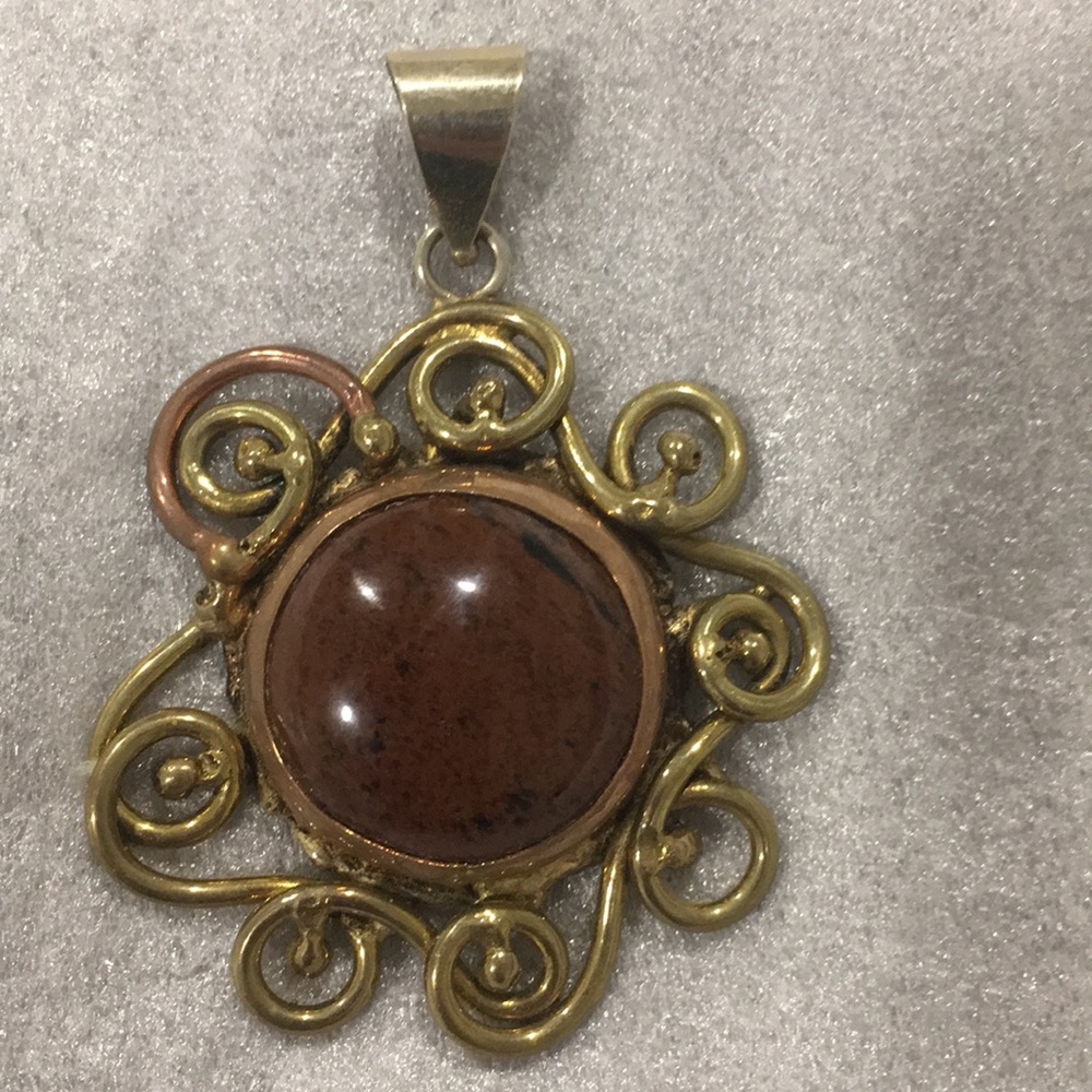 Hand crafted gold and bronze metal pendant